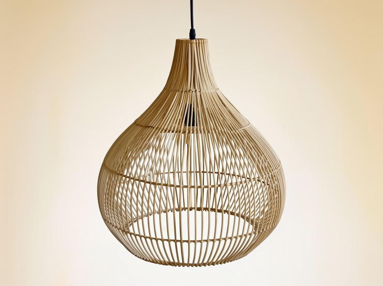 Aurelia woven rattan pendant lamp on a neutral background