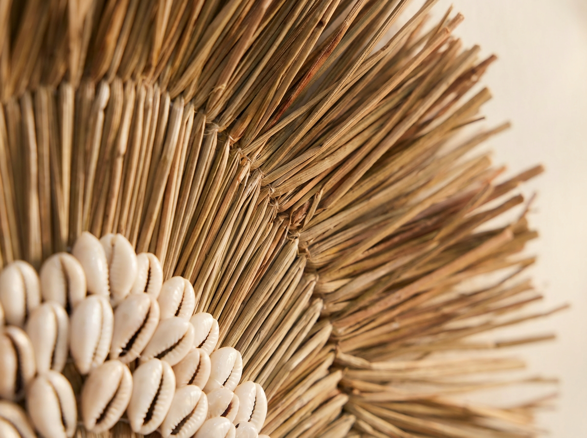 Close-up of the natural fibres and shell detail on a Solaya wall circle