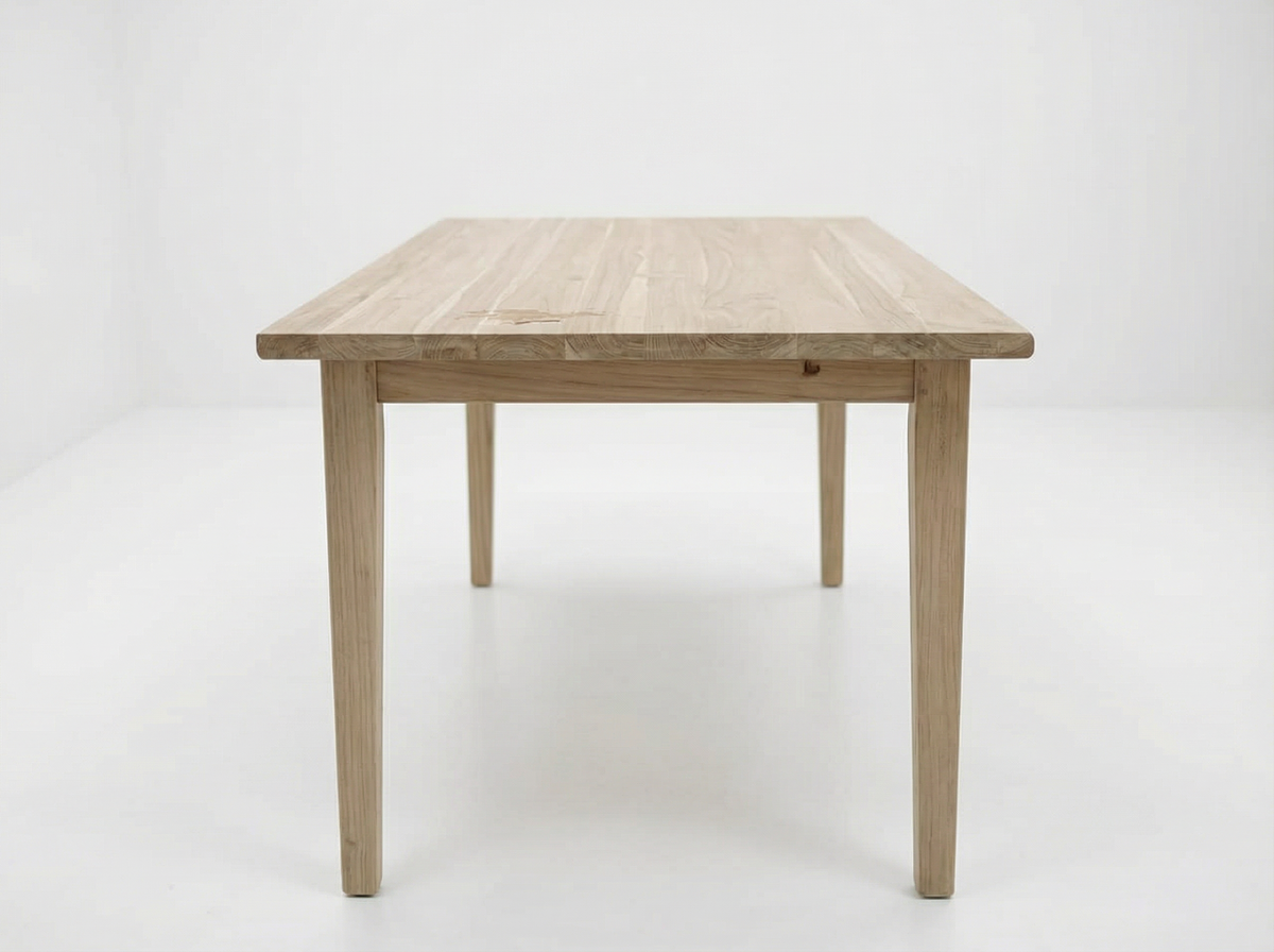 Haven small solid teak dining table on a white background